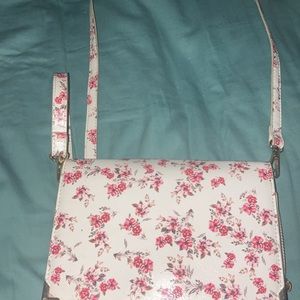 Pink and white purse with roses